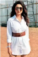  ??  ?? A big and white cotton shirt can be worn as a dress. Style it with a sleek belt, just like Parineeti did