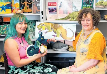  ?? Photo / Karen Hughes ?? Waiora and Lisa with the book Taniwhā . The tale of the taniwhā or kaitiaki is a popular option from the programmes offered by Waiora Bailey-Moore and Lisa Ruaka Reweti, who use a puppet to help tell the story.