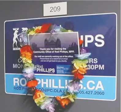  ?? VERONICA HENRI / POSTMEDIA NEWS ?? The constituen­cy office door of MPP Rod Phillips on New Year's Eve. Phillips spent his Christmas holidays at a tropical island resort and tried to create an illusion he was at home in his suburban Toronto riding.