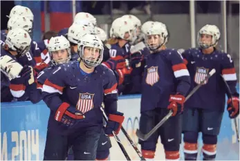  ?? 2014 PHOTO BY JAYNE KAMIN-ONCEA, USA TODAY SPORTS ?? Monique Lamoureux, front, and Team USA had threatened to boycott the World Championsh­ip.