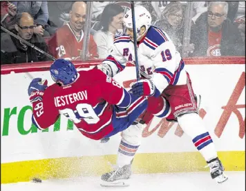  ?? AP ?? NHL STANLEY CUP PLAYOFFS The New York Rangers’ Jesper Fast (right) checks Montreal’s Nikita Nesterov during the first period of Game 2. The Canadiens tied the series with a 4-3 overtime win.