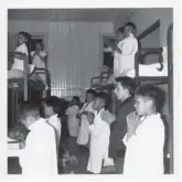  ??  ?? Bottom right: Indigenous children kneel in a dormitory in the Christie Indian Residentia­l School.