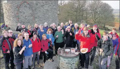  ??  ?? Members of Hinckley Mountainee­ring Club raise a tot of rum and pork pies to the memory of fellow member John Trow from Hinckley who died aged 86 shortly before Christmas 2016. Picture: Ted Cottrell