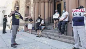  ?? Will Waldron / Times Union ?? The Rev. Joe Paparone, of the Labor-religion Coalition, speaks Monday outside Albany City Hall. Housing advocates urged officials to continue an eviction moratorium and cancel rent for the duration of the pandemic.