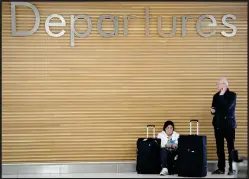  ??  ?? Stranded travellers at Glasgow Airport after all flights were cancelled,l eft