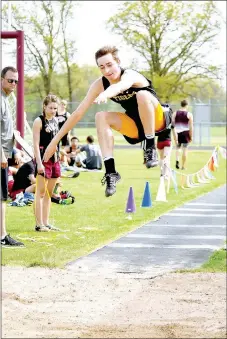  ?? SHELLEY WILLIAMS SPECIAL TO THE ENTERPRISE-LEADER ?? Prairie Grove realized an almost immediate benefit to acquiring equipment for jumping practice in 2017. Prairie Grove sophomore Nick Pohlman, shown competing in mid-April, won the 4A-1 Conference long jump championsh­ip with a leap of 20-03.00 April 25.