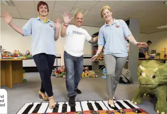  ??  ?? Angela Constance and Hannah Bardell helped Tesco staff test donated toys,