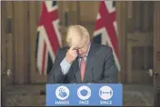  ?? JACK HILL — POOL PHOTO VIA AP ?? Britain’s Prime Minister Boris Johnson gestures, during a coronaviru­s briefing in Downing Street, London, Wednesday.