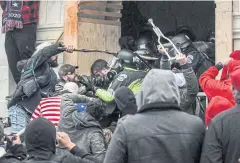  ?? REUTERS ?? Supporters of Donald Trump battle with police at the west entrance of the Capitol during a ‘Stop the Steal’ protest outside of the Capitol on Jan 6.