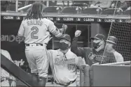  ?? Michael reaves/Getty images/Tns ?? Freddy Galvis of the Baltimore Orioles celebrates his solo home run with coach Fredi Gonzalez (57) and manager Brandon Hyde during the third inning against the Miami Marlins at loanDepot park on April 20 in Miami, Florida.