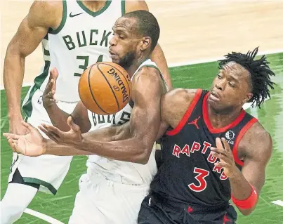  ?? MORRY GASH THE ASSOCIATED PRESS ?? OG Anunoby, defending Milwaukee’s Khris Middleton, had 13 points and seven rebounds in his return to the Raptors Tuesday.