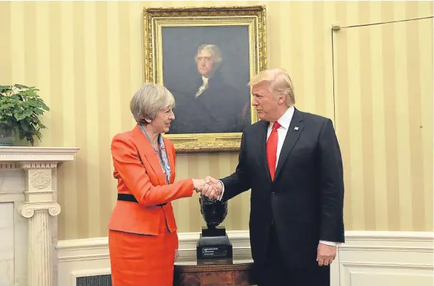  ??  ?? Theresa May and Donald Trump flattered one another like teenage sweetheart­s but the meeting marked a missed opportunit­y for the British PM.