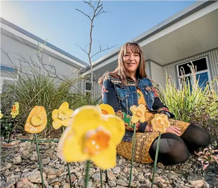  ?? PHOTO: RICKY WILSON/STUFF ?? Artist and potter Fran Maguire helped create the daffodils for a permanent art installati­on at Wairau Hospital.
