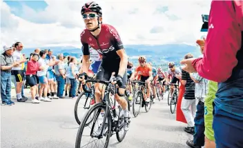  ??  ?? Tour countdown: Geraint Thomas (right) takes a break at Team Ineos’s training camp in Tenerife in May and (above) during the second stage of the Tour of Switzerlan­d last month – he quit the race following a crash on the fourth stage
