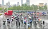  ?? REUTERS ?? People line up at a makeshift nucleic acid testing site for Covid-19 in Chaoyang district of Beijing, China, on Wednesday.