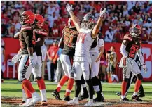  ?? JIM DAMASKE / TAMPA BAY TIMES ?? Tampa Bay’s Cameron Brate (84) enjoys watching Buccaneers kicker Chandler Catanzaro’s game-winning 59-yard field goal in overtime Sunday against the Browns.