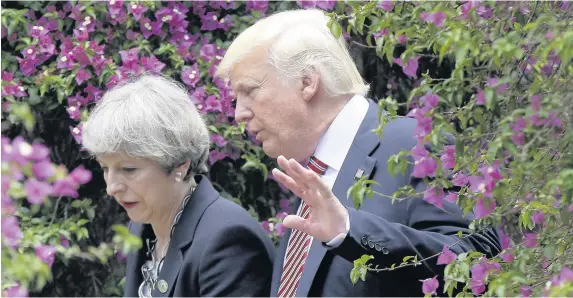  ?? Luca Bruno ?? > President Donald Trump speaks with Prime Minister Theresa May in Taormina, Italy, yesterday at the meeting of G7 leaders