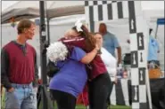  ?? MARIAN DENNIS — DIGITAL FIRST MEDIA ?? The Relay for Life Pottstown was emotional for many participan­ts on Saturday. In addition to raising money for cancer research, the relay also celebrates those who have survived or are still battling cancer.