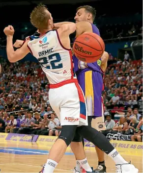  ?? GETTY IMAGES ?? Sydney’s Andrew Bogut, right, fouls Adelaide’s Anthony Drmic.