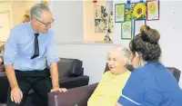  ??  ?? ●●Steve Rumbelow, chief executive at Rochdale Borough Council, speaks to 89-year-old patient Evelyn Alcock at the Oasis dementia unit