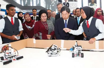  ??  ?? Permata Pintar student Nur Addina Amiruddin, 15, (right), explaining her project to Japan’s Crown Prince Naruhito (second from right) during the Prince’s visit to the Permata Pintar centre with Datin Seri Rosmah Mansor, patron of Permata Pintar...