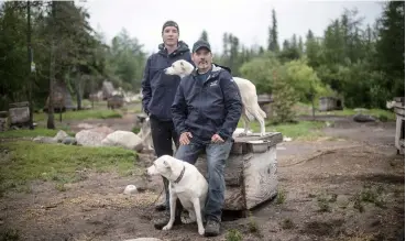  ?? Photo: AFP ?? Canadian musher David Daley (front), poses with his son Wyatt Daley in Churchill, northern Canada on August 10, 2022.