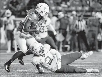  ?? Eric Gay / Associated Press ?? Texas’ Lil'Jordan Humphrey makes one of his 70 catches this year, a total that ranks fifth on the school’s single-season list with three games to play if the Longhorns reach the Big 12 title game.