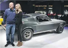  ??  ?? Sean Kiernan, the owner of the 1968 Ford Mustang from the film Bullitt, with Molly McQueen, granddaugh­ter of Steve McQueen, the film’s star.