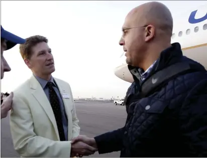  ?? RICK SCUTERI — THE ASSOCIATED PRESS FILE ?? Penn State head coach James Franklin is greeted by Fiesta Bowl executive director Mike Nealy in preparatio­n for an upcoming NCAA college football bowl game against Washington during 2017in Phoenix.