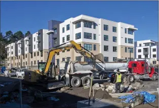  ?? KARL MONDON — STAFF ARCHIVES ?? Constructi­on nears completion on 122subsidi­zed apartments for teachers and staff in the Jefferson Union High School District in 2021in Daly City. On Feb. 7, three pro-housing groups announced they had sued 11cities, including Daly City, for failing to meet a Jan. 31 deadline to submit their future homebuildi­ng proposals to state regulators.