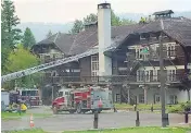  ?? NATIONAL PARK SERVICE / VIA THE ASSOCIATED PRESS ?? This photo provided by the U.S. National Park Service on Sunday shows a fire truck positioned outside Lake McDonald Lodge in Glacier National Park, Mont., as a fire threatens the century-old Swiss chalet-style hotel.