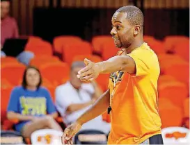  ?? [PHOTO BY SARAH PHIPPS, THE OKLAHOMAN] ?? Oklahoma State basketball coach Mike Boynton addressed the situations surroundin­g guard Michael Weathers and OSU’s reported involvemen­t in an FBI investigat­ion after Sunday’s open practice at John Marshall High School.