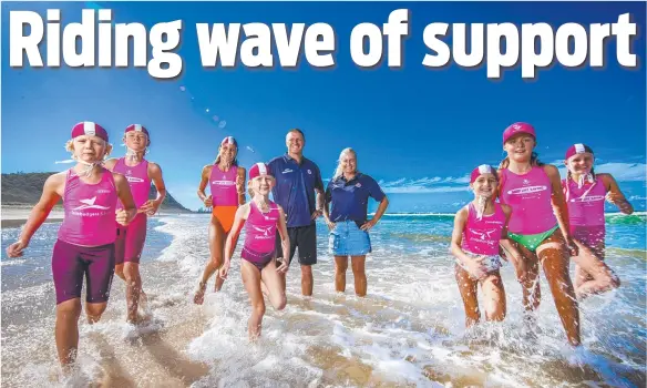  ?? ?? Surf sports ambassador­s Trevor Hendy and Karla Gilbert are backing the Olympic bid with nippers (from left) Kane Brown, 9, Ky Brown, 13, Soraya Glore, 12, Emily Brown, 8, Cleo Glore, 8, Alexandra Mair, 11 and Evie Glore, 10. Picture: Nigel Hallett