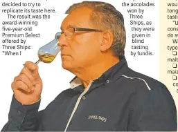  ??  ?? LEADING BY THE NOSE: Award-winning whisky distiller Andy Watts savours the aroma