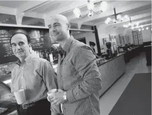  ?? DARREN CALABRESE / NATIONAL POST ?? Java Joe’s founder Costa Kiriakopou­los, left, and son Alex, co-founder of Black Rabbit Café.