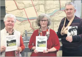  ?? ?? Jean Kavanagh, Fermoy Library pictured in the centre accepting two books from Kathleen McConville and Kieran Jordan, representi­ng the Old Kilcrumper Graveyard Friends Associatio­n.