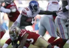  ?? THE ASSOCIATED PRESS ?? Giants running back Orleans Darkwa (26) runs against the San Francisco 49ers during Sunday’s game in Santa Clara, Calif.