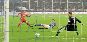  ?? AP ?? James Rodriguez scores a goal against Schalke during the Bundesliga match. —