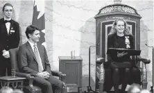  ?? REUTERS ?? Prime Minister Justin Trudeau listens as then governor general Julie Payette delivers the throne speech in 2019.