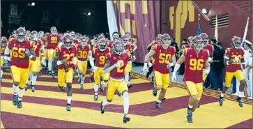 ?? Meg Oliphant Getty Images ?? REVENUE generated by Power 5 conference teams such as USC, above, isn’t worth the risk in a pandemic.