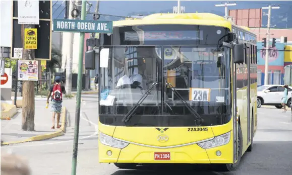  ?? ?? A Jamaica Urban Transit Company bus about to leave Half-way-tree in St Andrew. The company has fallen short in supplying the required fleet for commuters with a roll-out of just 175 units per day.