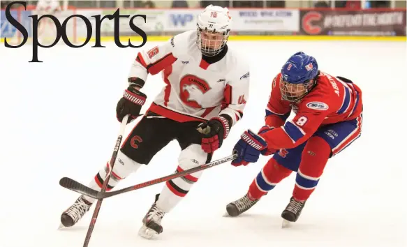  ?? CITIZEN PHOTO BY JAMES DOYLE ?? Cariboo Cougars forward Brett Fudger drives to the net while being checked by Vancouver North East Chiefs defender Zach Abenante on Friday night at Kin 1.