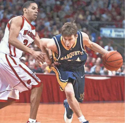  ?? FILE PHOTO ?? Marquette's Travis Diener drives past Wisconsin's Devin Harris during a 2003 game in Madison. Both were Class of 2001 recruits from Wisconsin high schools.