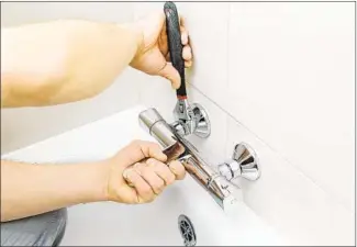  ?? GETTY IMAGES ?? A stylish new faucet can instantly upgrade a bathroom. Tr y to match the finish to other metals and finishes already found in the room.