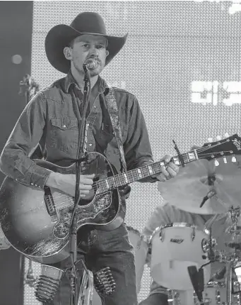  ?? Yi-chin Lee / Staff file photo ?? Turnpike Troubadour­s’ Evan Felker plays in Houston in 2019. That year amid his personal and health woes, the band went on hiatus. Now it’s back — the show tonight at Floore’s is sold out.