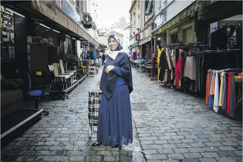  ?? JOHANNES SIMON/ GETTY; JENS SCHLUETER/AFP/ GETTY; SANDER DE WILDE FOR NATIONAL POST ?? Zhour Lamraoui emigrated from Morocco to Belgium six years ago. She worries a religious war could erupt. “It is taboo to speak of Islam in Europe today,” she says. “If you do, they immediatel­y call you a terrorist.”