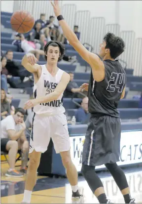  ?? Nikolas Samuels/The Signal ?? West Ranch’s Austin Galuppo (33) passes the ball during a home match as Camarillo’s Jaime Jaquez Jr. (24) tries to guard him last week.