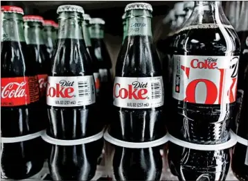  ?? JOE RAEDLE/GETTY 2014 ?? Some studies have raised concerns about the long-term health consequenc­es of drinking so many diet Cokes.