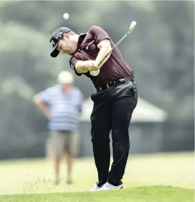  ?? EPA ?? SWEETLY STRUCK: Branden Grace plays a shot during the first round of the SA Open at Glendower yesterday.