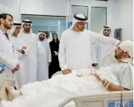  ?? Wam file ?? A file photo of Sheikh Mohamed bin Zayed Al Nahyan, Crown Prince of Abu Dhabi and Deputy Supreme Commander of the UAE Armed Forces, visiting an injured Juma Al Kaabi, at Al Mafraq hospital in Abu Dhabi on January 14.—